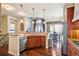 This kitchen has stainless steel appliances, and a dining area for breakfast and lunch at 13901 E Saratoga Pl, Aurora, CO 80015