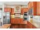 Close up of stainless steel appliances and custom cabinetry in kitchen at 13901 E Saratoga Pl, Aurora, CO 80015
