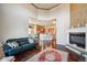 Bright living room showcases a fireplace and hardwood floors flowing into an open kitchen at 13901 E Saratoga Pl, Aurora, CO 80015
