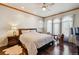 Spacious main bedroom features a ceiling fan, and a large window at 13901 E Saratoga Pl, Aurora, CO 80015