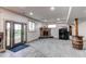 Finished basement with brick fireplace, barrel table, and a rustic doorway at 42919 Vista Rdg, Parker, CO 80138