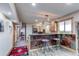 Finished basement boasts a bar with seating and adjacent hallway at 42919 Vista Rdg, Parker, CO 80138