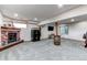 Spacious finished basement featuring fireplace, barrel table, and mounted television at 42919 Vista Rdg, Parker, CO 80138