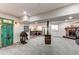 Expansive finished basement includes a bar, fireplace, and rustic design elements at 42919 Vista Rdg, Parker, CO 80138