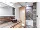 Bathroom showcasing rustic vanity, copper sink, and modern fixtures at 42919 Vista Rdg, Parker, CO 80138