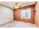 Basement bedroom with neutral carpet, tan walls, and a window at 42919 Vista Rdg, Parker, CO 80138
