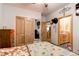 Cozy bedroom with wood-paneled closet and ensuite bathroom; decorative accents on the walls for added charm at 42919 Vista Rdg, Parker, CO 80138