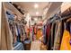 Spacious walk-in closet with ample shelving and hanging space for organized storage of clothes and accessories at 42919 Vista Rdg, Parker, CO 80138