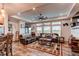 Comfortable living room with hardwood floors, a ceiling fan, and large windows at 42919 Vista Rdg, Parker, CO 80138