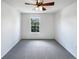 Minimalist bedroom showcasing neutral carpeting, a ceiling fan, and a window with a pleasant view at 1491 Ophir Rd, Castle Rock, CO 80109