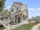 Inviting two-story home with a charming front porch and well-maintained landscaping at 1491 Ophir Rd, Castle Rock, CO 80109