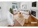 Bright living room showcasing a fireplace and large windows for natural light at 1491 Ophir Rd, Castle Rock, CO 80109