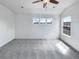 Spacious bedroom showcasing a large window and ceiling fan at 1491 Ophir Rd, Castle Rock, CO 80109