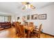 Inviting dining area with a wooden table, chairs, and stylish decor with hardwood flooring at 7590 E Easter Pl, Centennial, CO 80112