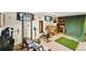 Workout space with a weight rack, exercise bike, and green turf area at 7590 E Easter Pl, Centennial, CO 80112