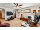 Spacious living room boasting a ceiling fan and an array of comfortable seating at 7590 E Easter Pl, Centennial, CO 80112