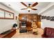 Inviting living room with wood-paneled accent wall and an array of comfortable seating at 7590 E Easter Pl, Centennial, CO 80112