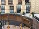 An aerial view of a balcony with seating and outdoor decor at 1901 Wazee St # 304, Denver, CO 80202