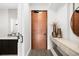 Elegant foyer featuring a stylish console table, decor, and a glimpse into the bathroom at 1901 Wazee St # 304, Denver, CO 80202