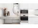 Decorative display shelf featuring decor next to stainless steel ovens at 1901 Wazee St # 304, Denver, CO 80202