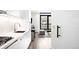 Modern open-concept kitchen with stainless appliances flowing into the living area at 1901 Wazee St # 304, Denver, CO 80202