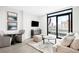 Relaxing living room boasts natural light, comfortable seating, and a view of the city from a window at 1901 Wazee St # 304, Denver, CO 80202