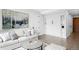 Sofa and murphy bed highlight this living room with art and sleek design at 1901 Wazee St # 304, Denver, CO 80202