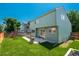 Expansive backyard with lawn, patio, grill, and play structure at 20445 Mitchell Pl, Denver, CO 80249