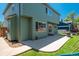 Backyard view with patio, grill, and a green lawn, perfect for outdoor enjoyment at 20445 Mitchell Pl, Denver, CO 80249