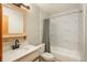 Bright bathroom featuring modern fixtures, white vanity, and a shower-tub combination with stylish tiling at 20445 Mitchell Pl, Denver, CO 80249
