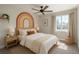 Stylized bedroom featuring white bedding, colorful wall art, and natural light, creating a fun and inviting space at 20445 Mitchell Pl, Denver, CO 80249