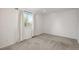 Neutral bedroom featuring plush carpeting and a window with white curtains at 20445 Mitchell Pl, Denver, CO 80249