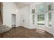 Bright living room with vaulted ceilings, hardwood floors, and large windows allowing ample natural light at 20445 Mitchell Pl, Denver, CO 80249
