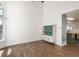 Open floor plan featuring hardwood floors, vaulted ceilings, and neutral paint at 20445 Mitchell Pl, Denver, CO 80249