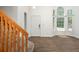 Bright living room with vaulted ceilings, hardwood floors, and large windows allowing ample natural light at 20445 Mitchell Pl, Denver, CO 80249