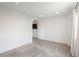 Well-lit living room featuring plush carpeting and an open archway at 20445 Mitchell Pl, Denver, CO 80249