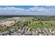Community aerial view showcasing green spaces, parks, and diverse home styles under a bright, partly cloudy sky at 1867 W 137Th Ln, Broomfield, CO 80023