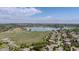 An aerial view of homes near a serene lake and green spaces; showcasing community and picturesque landscape at 1867 W 137Th Ln, Broomfield, CO 80023