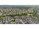 Expansive aerial view of a residential neighborhood with lush green spaces and winding streets at 1867 W 137Th Ln, Broomfield, CO 80023
