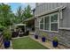 A cozy backyard featuring a patio, outdoor furniture, and artificial turf for a relaxing outdoor space at 1867 W 137Th Ln, Broomfield, CO 80023