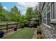 A patio with outdoor seating, artificial grass, and beautiful greenery; making for an inviting outdoor living space at 1867 W 137Th Ln, Broomfield, CO 80023