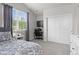 Bedroom featuring bed, window, desk and sliding closet doors at 1867 W 137Th Ln, Broomfield, CO 80023