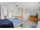 Spacious bedroom featuring vaulted ceilings, neutral walls, and a charming wooden bed frame at 1867 W 137Th Ln, Broomfield, CO 80023