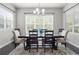 Bright dining room featuring a large window, wooden table, and decorative rug at 1867 W 137Th Ln, Broomfield, CO 80023