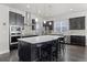 Contemporary kitchen with a spacious island, sleek cabinetry, and updated stainless steel appliances at 1867 W 137Th Ln, Broomfield, CO 80023
