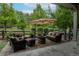 A charming outdoor patio featuring wicker furniture, a fire pit, and string lights, perfect for entertaining at 1867 W 137Th Ln, Broomfield, CO 80023