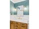 Elegant bathroom with marble countertops, wood vanity, and gold accents at 2098 N Clarkson St, Denver, CO 80205