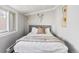 Cozy bedroom featuring a soft bed with plush blankets and decorative pillows at 2098 N Clarkson St, Denver, CO 80205