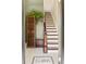 Elegant entryway featuring classic tile and stairs with a dark wood railing at 2098 N Clarkson St, Denver, CO 80205