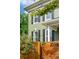 Close-up of the exterior, showcasing painted brick, black shutters, and an address display at 2098 N Clarkson St, Denver, CO 80205